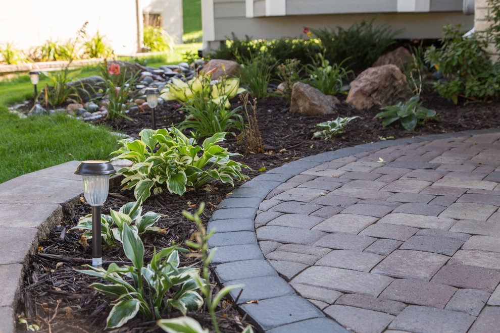 Inspiration for a small front yard patio in Minneapolis with concrete pavers.