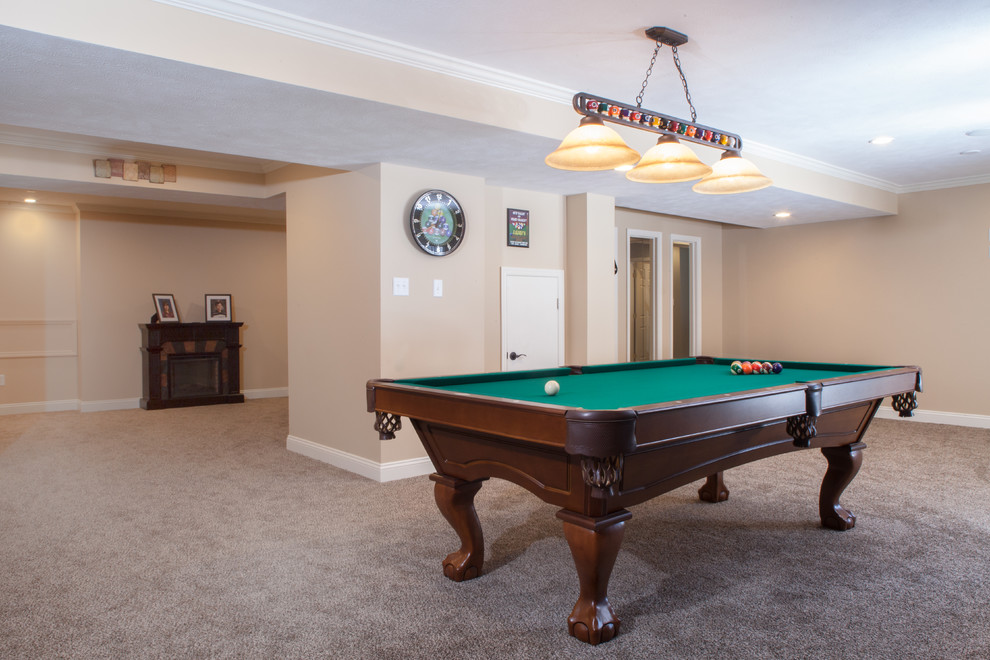 Basement - large transitional walk-out carpeted basement idea with gray walls and no fireplace