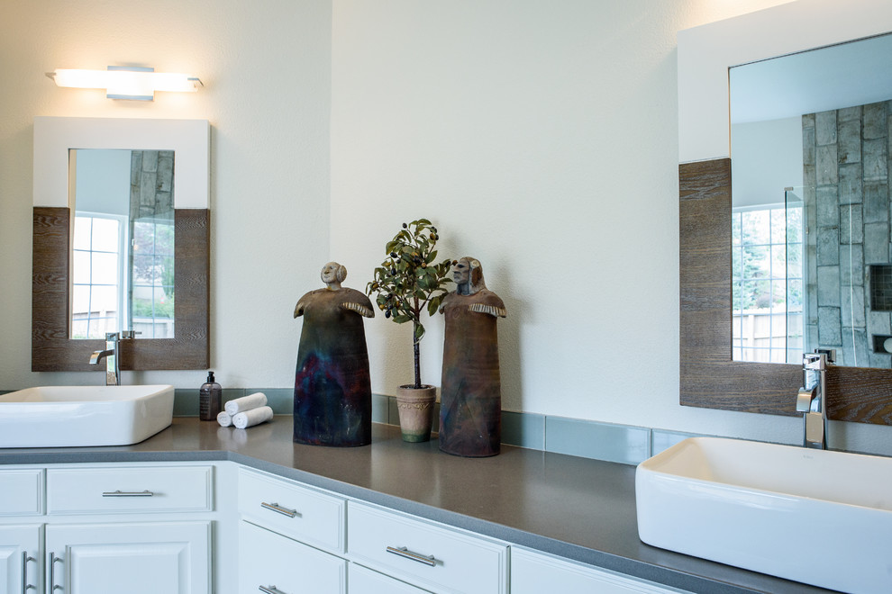 Inspiration for a large transitional master gray tile and glass tile concrete floor drop-in bathtub remodel in Denver with shaker cabinets, white cabinets, white walls, a vessel sink and quartz countertops