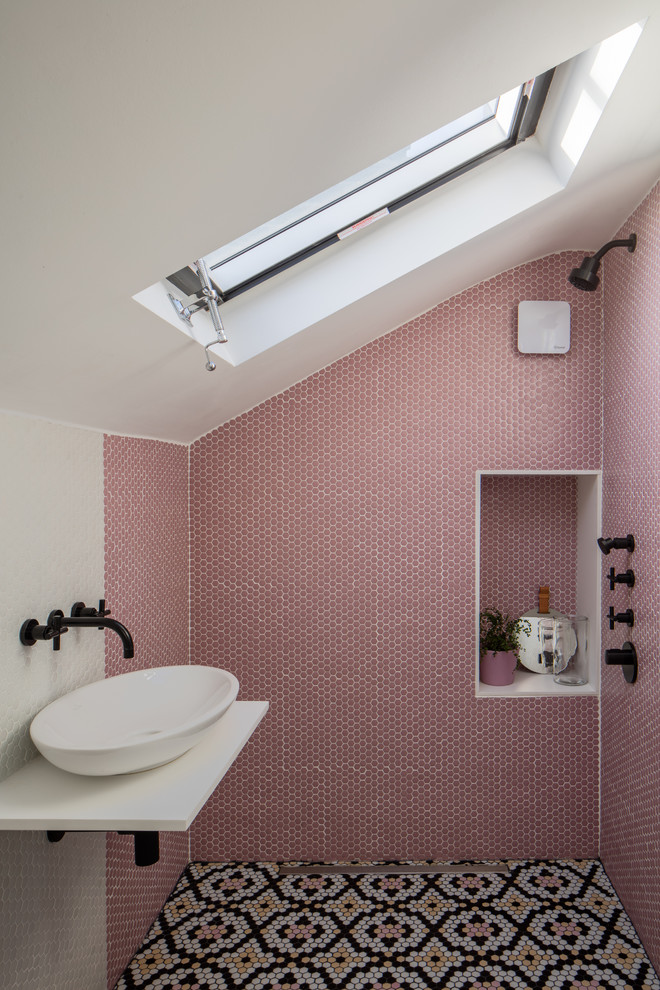 Inspiration for a scandinavian 3/4 bathroom in London with pink tile, mosaic tile, white walls, mosaic tile floors, a vessel sink, multi-coloured floor, an open shower and white benchtops.