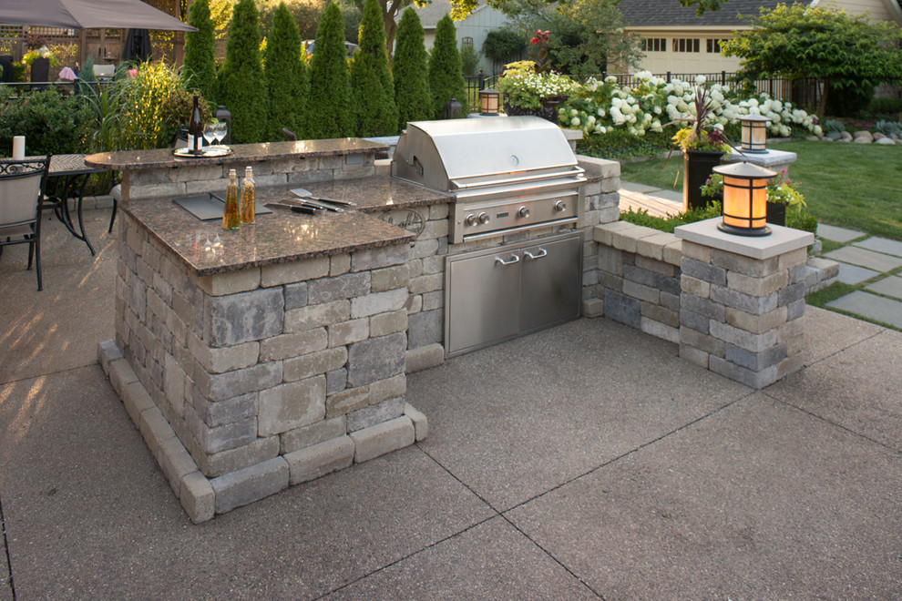Design ideas for a mid-sized transitional backyard patio in Detroit with brick pavers, a fire feature and no cover.
