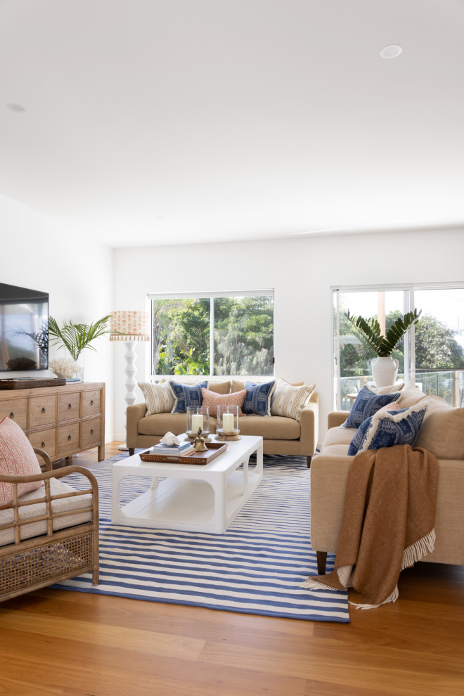 Photo of a beach style living room in Brisbane.