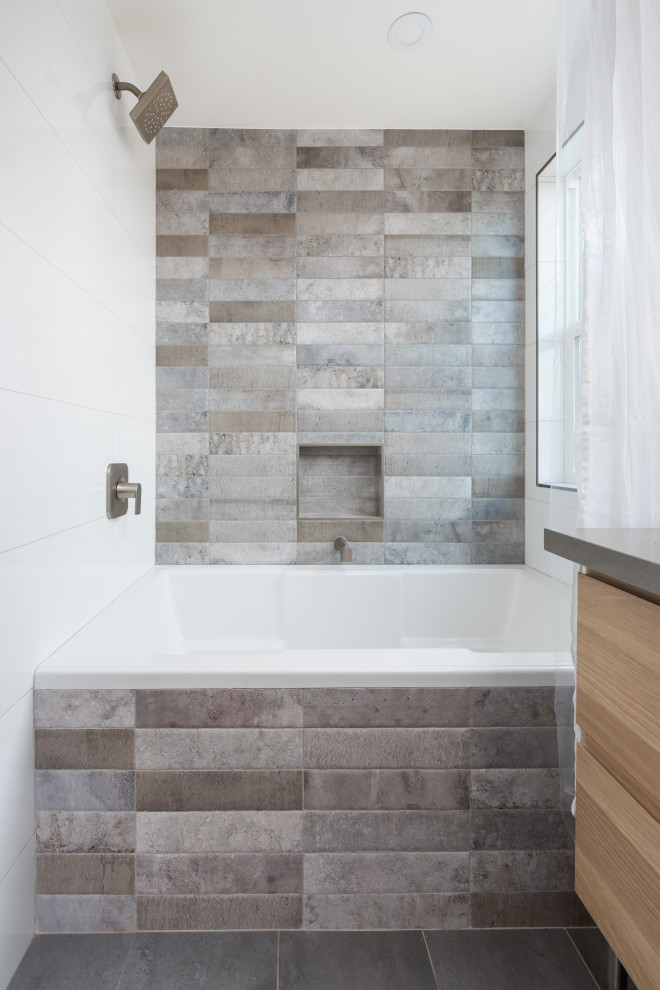 Design ideas for a medium sized classic bathroom in San Francisco with brown cabinets, an alcove bath, a shower/bath combination, a two-piece toilet, porcelain tiles, grey walls, a vessel sink, concrete worktops, grey floors, a shower curtain, grey worktops, double sinks and a freestanding vanity unit.
