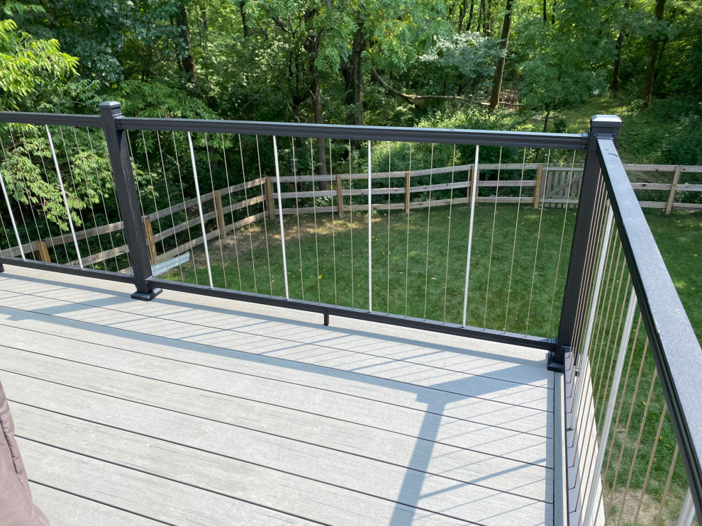 Large transitional backyard second story metal railing deck photo in Cincinnati