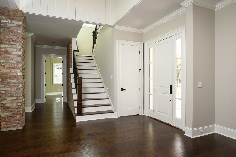 Design ideas for a mid-sized traditional wood u-shaped staircase in Jacksonville with painted wood risers.