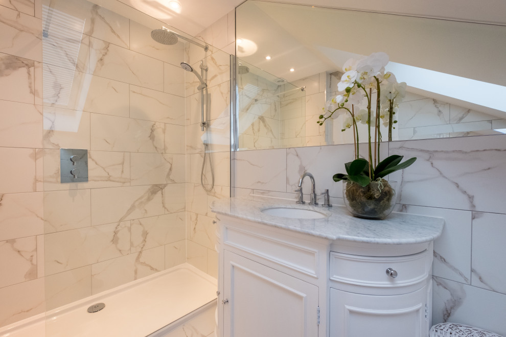 Inspiration for a mid-sized beach style master bathroom in Other with shaker cabinets, white cabinets, an open shower, a one-piece toilet, yellow tile, marble, white walls, laminate floors, marble benchtops, white floor, an open shower, white benchtops, a single vanity and a freestanding vanity.