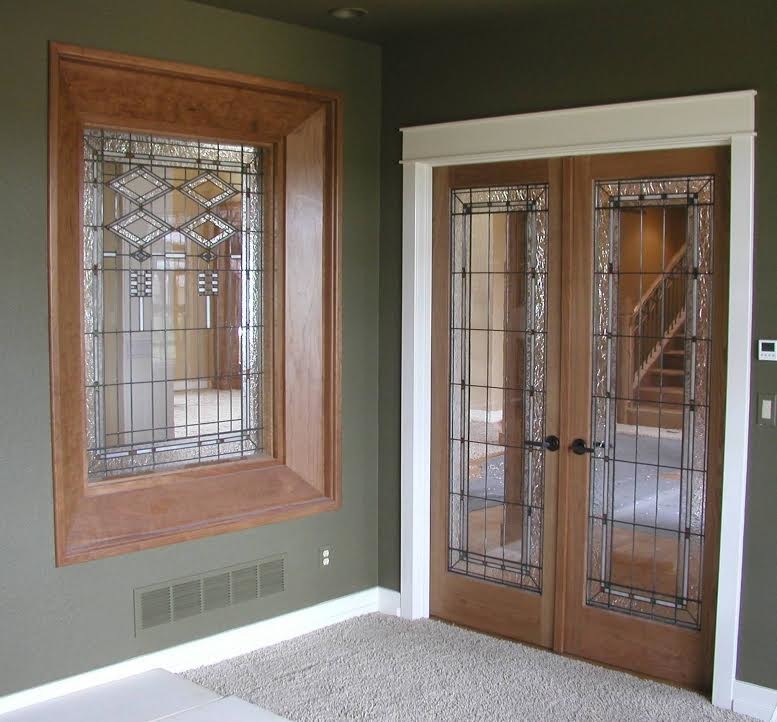 Inspiration for a mid-sized traditional entryway in Denver with grey walls and carpet.