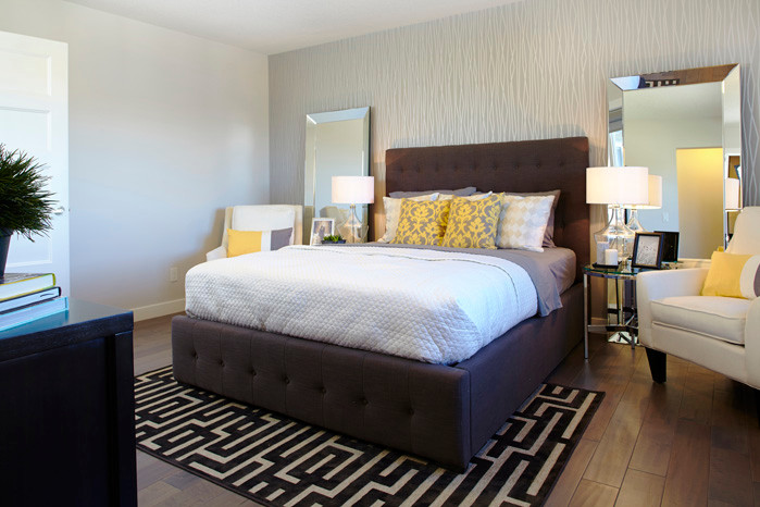Inspiration for a large contemporary master bedroom in Calgary with multi-coloured walls and light hardwood floors.