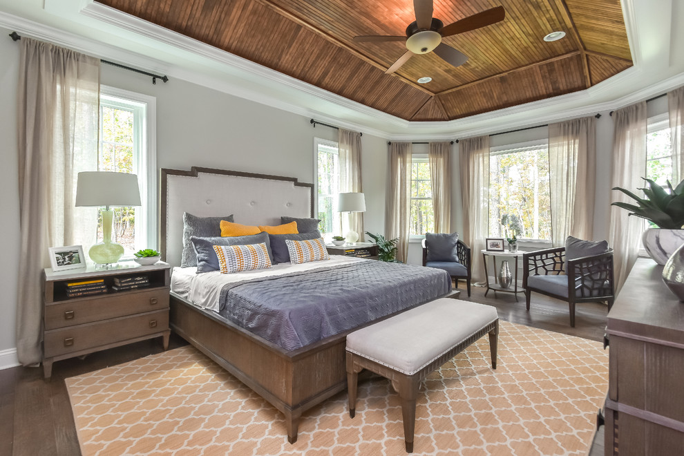 Design ideas for a large traditional master bedroom in Richmond with grey walls, dark hardwood floors and brown floor.