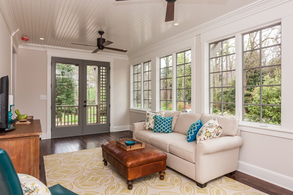 Design ideas for a mid-sized traditional sunroom in Raleigh with dark hardwood floors and brown floor.