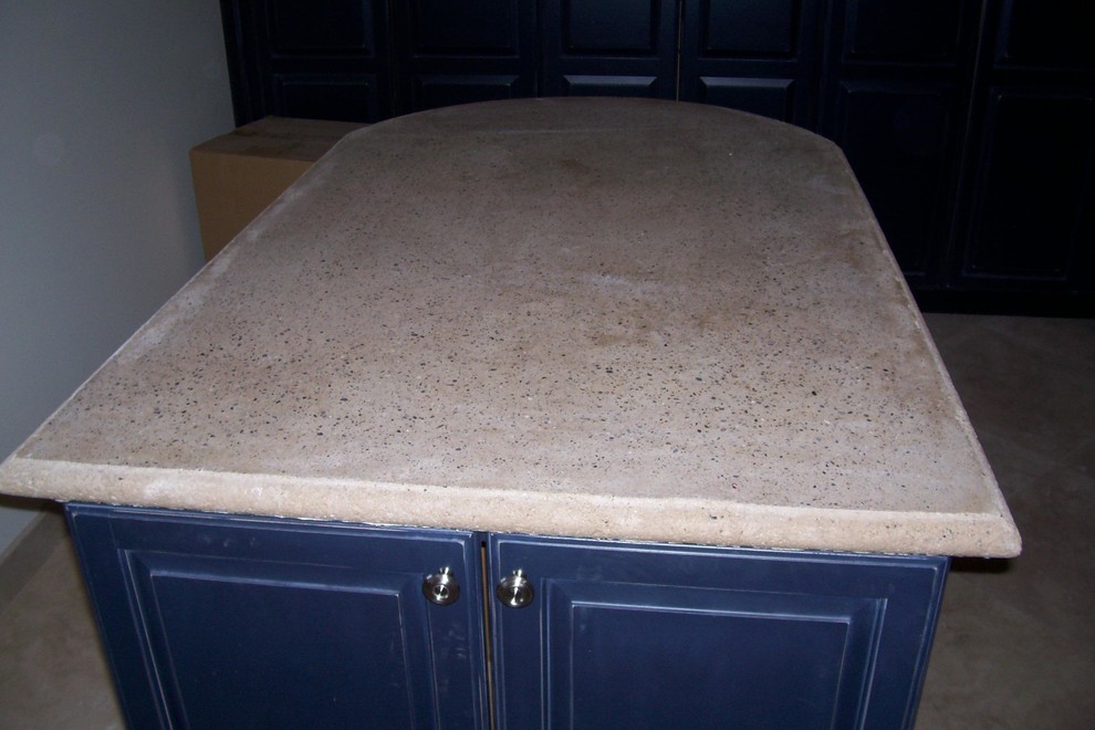 Example of a large mountain style kitchen design in Phoenix with concrete countertops