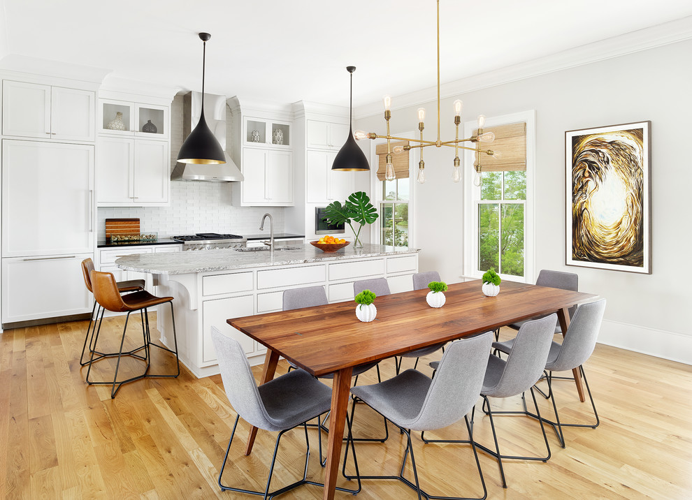 Photo of a transitional open plan dining in Charleston with grey walls, light hardwood floors and beige floor.