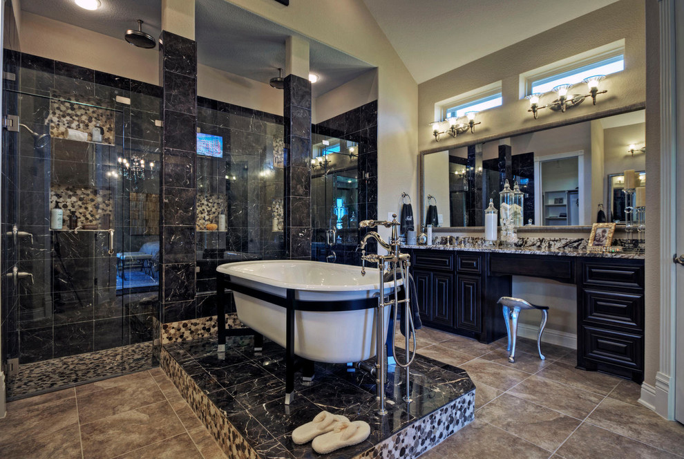 Expansive contemporary master bathroom in Dallas with a double shower, a freestanding tub, beaded inset cabinets, dark wood cabinets, black tile, porcelain tile, beige walls, ceramic floors, a drop-in sink and granite benchtops.