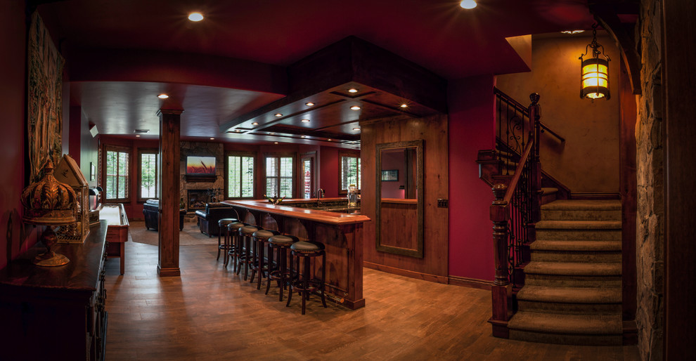 Inspiration for a large l-shaped seated home bar in Salt Lake City with beaded inset cabinets, dark wood cabinets, wood benchtops, dark hardwood floors, an undermount sink, multi-coloured splashback and brown benchtop.
