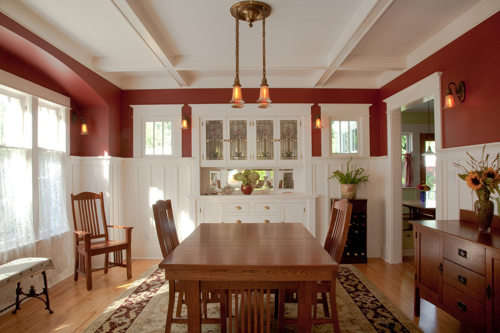 Inspiration for a large arts and crafts separate dining room in Seattle with red walls, light hardwood floors and no fireplace.