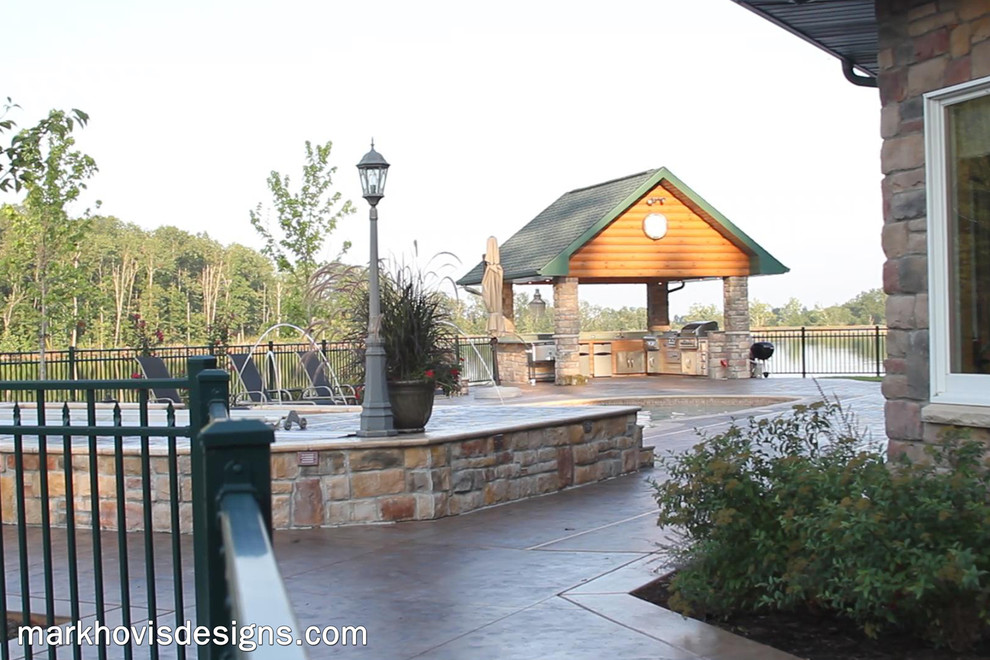 Mountain style front yard wood, stone and custom-shaped natural pool fountain photo