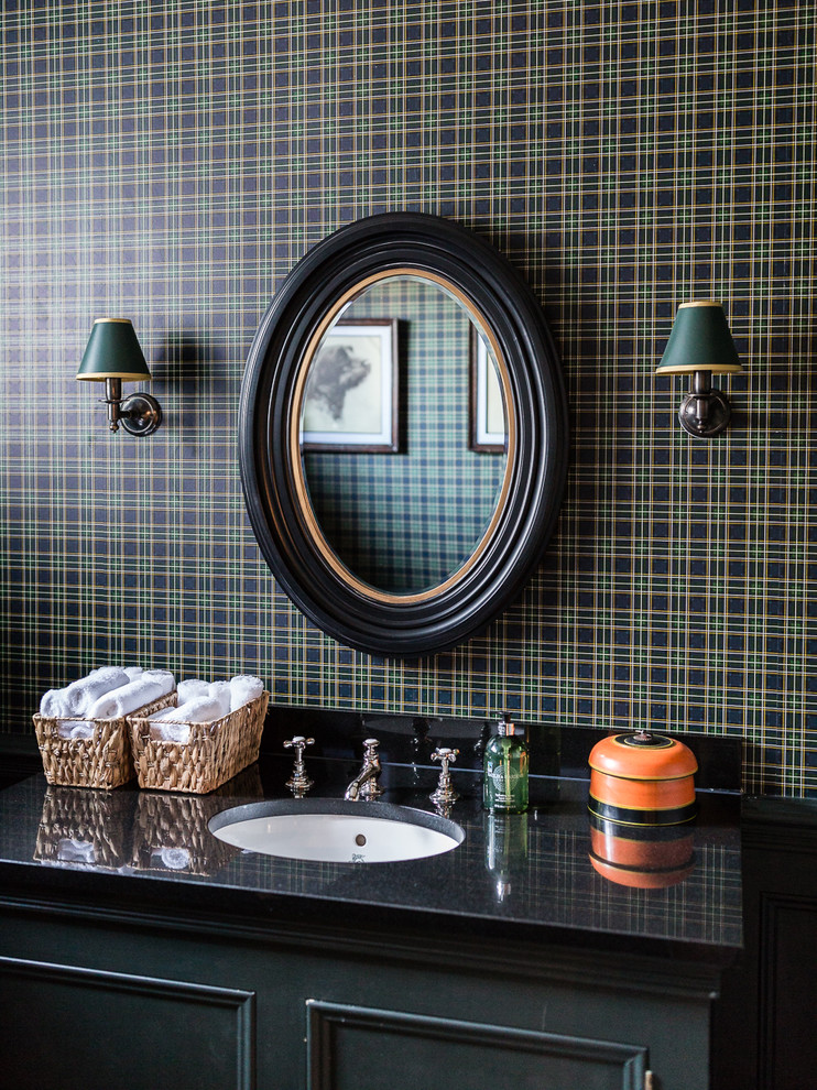 Mid-sized country bathroom in London with black and white tile and cement tile.