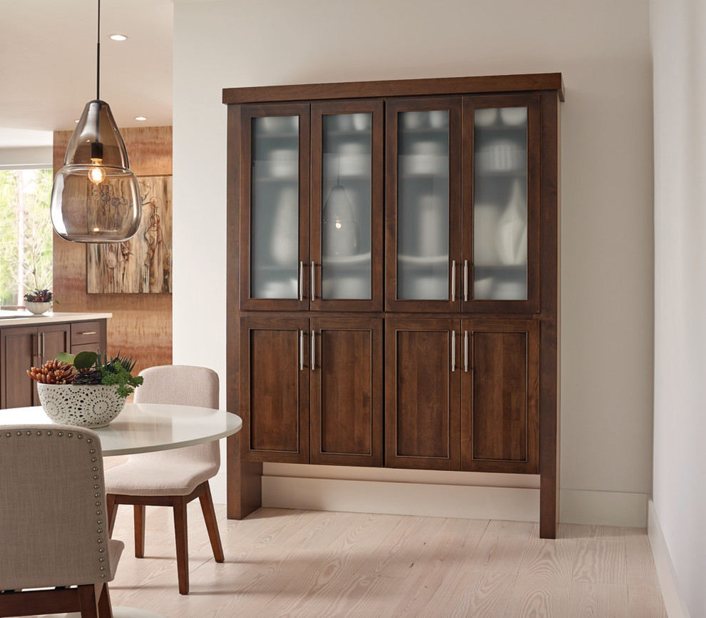 Example of a large transitional single-wall light wood floor open concept kitchen design with an island, an undermount sink, recessed-panel cabinets, medium tone wood cabinets and stainless steel appliances