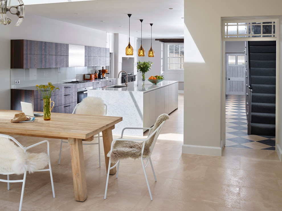 Contemporary galley eat-in kitchen in Devon with a single-bowl sink, flat-panel cabinets, grey cabinets, marble benchtops, limestone floors, with island, grey splashback, glass sheet splashback and stainless steel appliances.