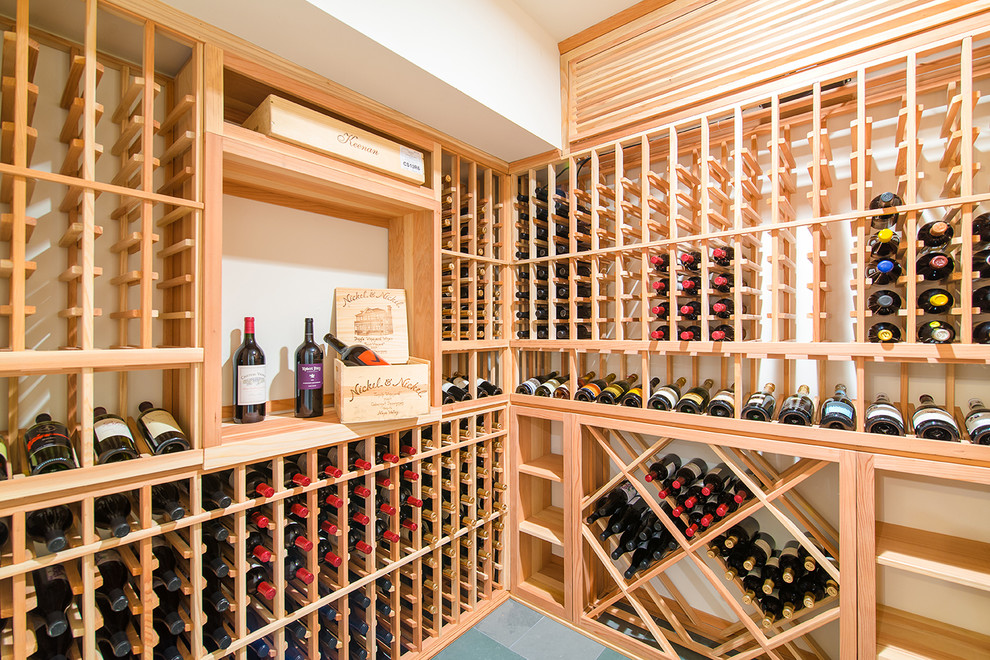 This is an example of a beach style wine cellar in Los Angeles with diamond bins.