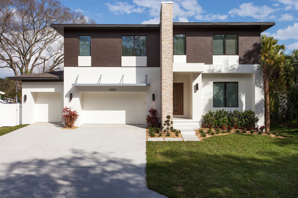 Inspiration for a modern two-storey stucco house exterior in Tampa.