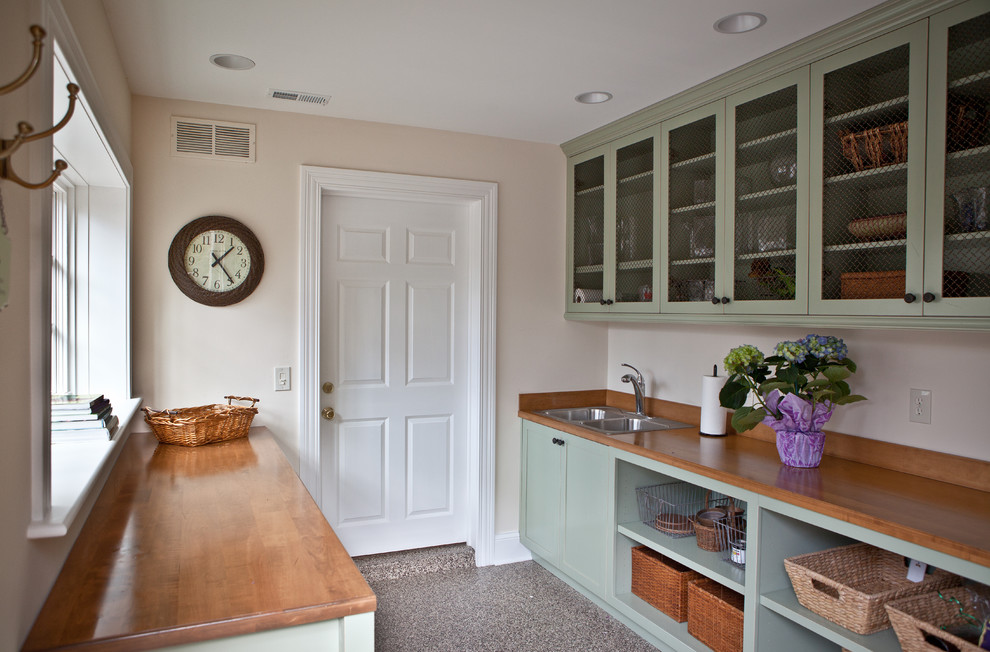 Design ideas for a traditional mudroom in St Louis with beige walls.