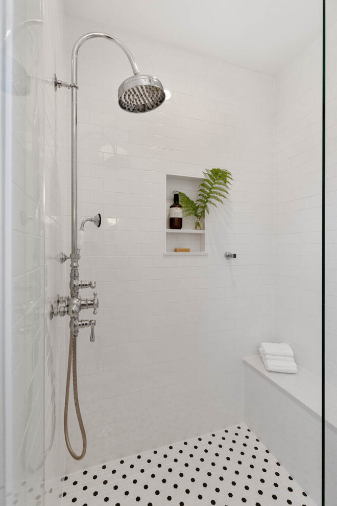 Inspiration for a traditional master bathroom in Other with grey cabinets, a two-piece toilet, white tile, subway tile, grey walls, ceramic floors, an undermount sink, engineered quartz benchtops, multi-coloured floor, a hinged shower door and white benchtops.