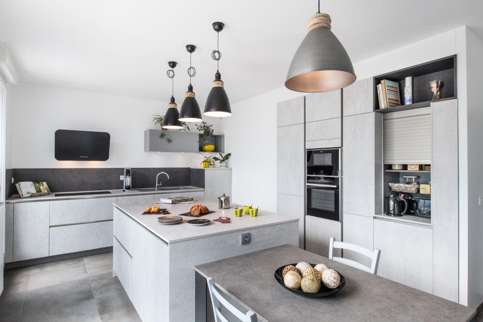 Large contemporary single-wall separate kitchen in Other with beaded inset cabinets, grey cabinets, laminate benchtops, grey splashback, stainless steel appliances, ceramic floors, with island, grey floor and grey benchtop.