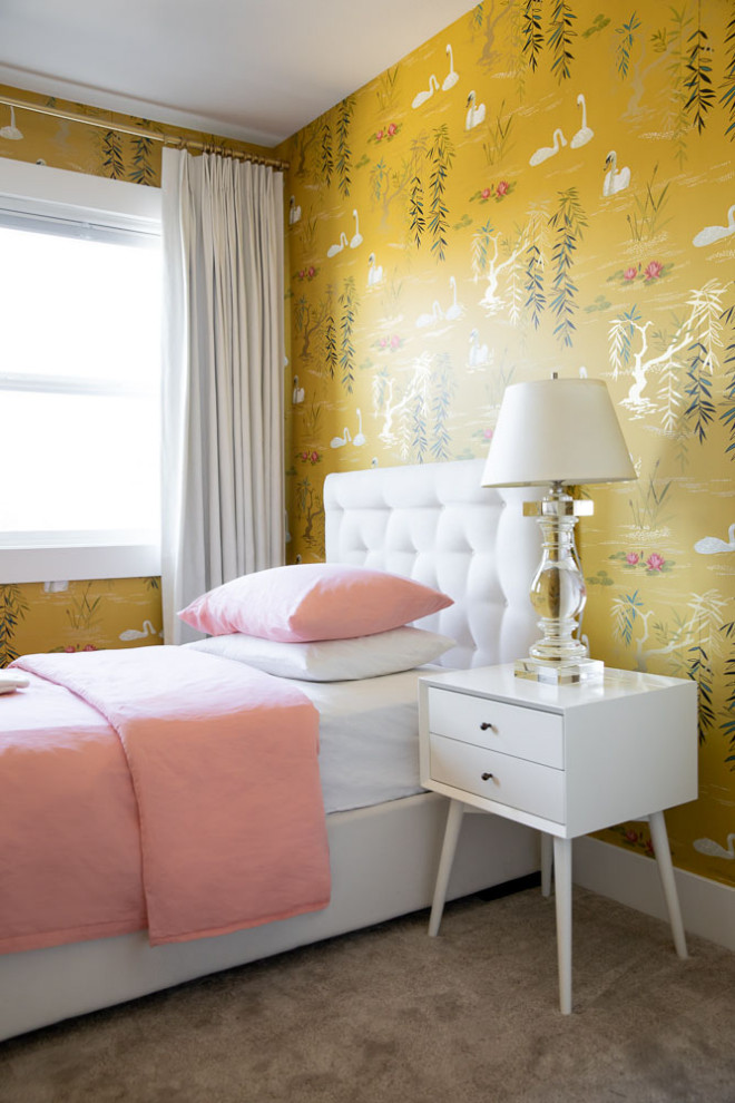 This is an example of a mid-sized modern bedroom in Other with yellow walls, carpet and grey floor.