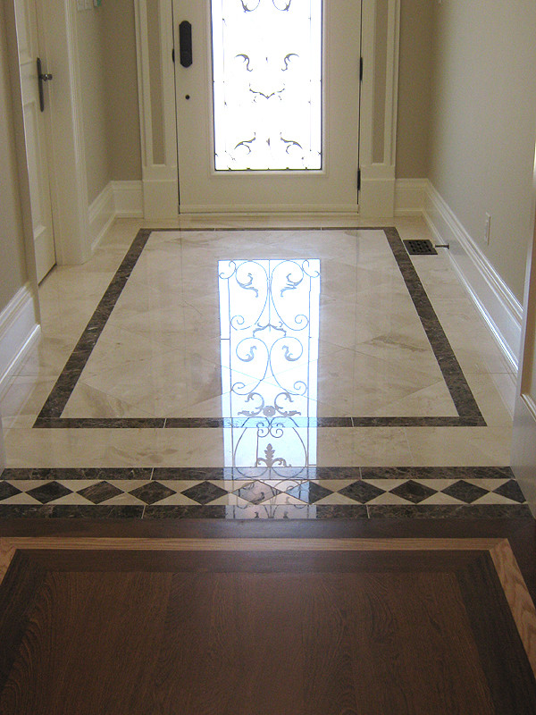 Inspiration for a large transitional ceramic tile foyer remodel in Toronto