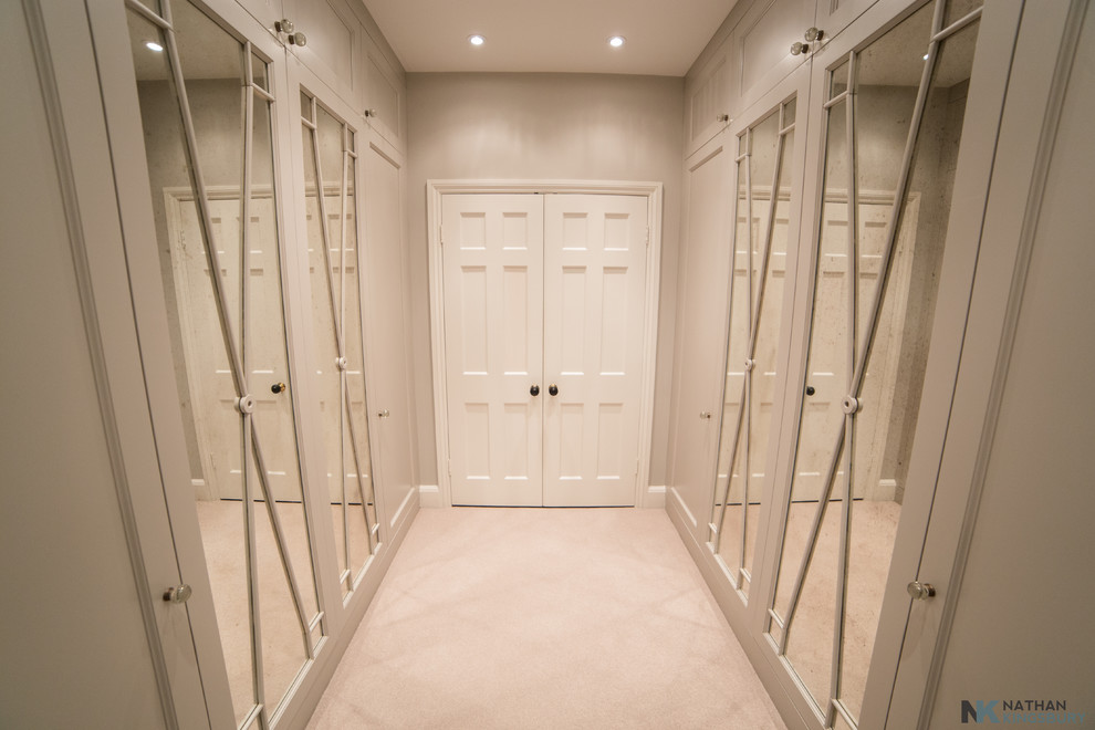 This is an example of a contemporary storage and wardrobe in Surrey.