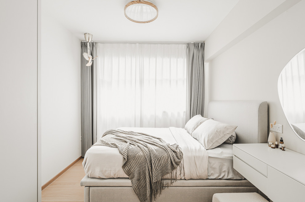 Photo of a Scandinavian bedroom in Singapore.