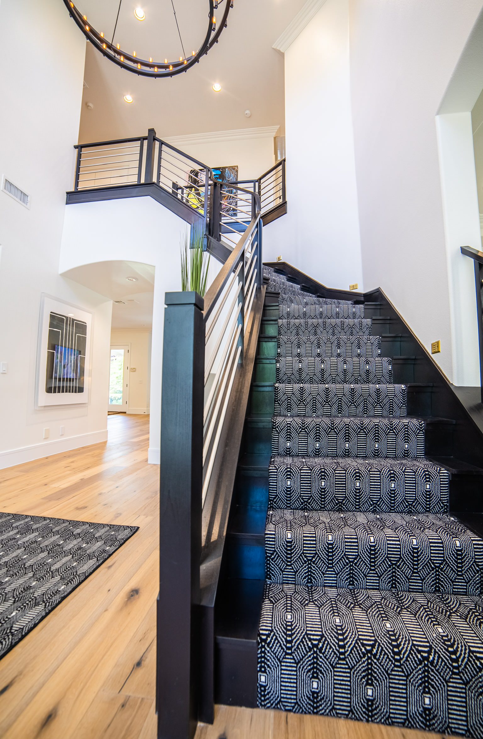 This black steel staircase makes for the perfect entry to this home!