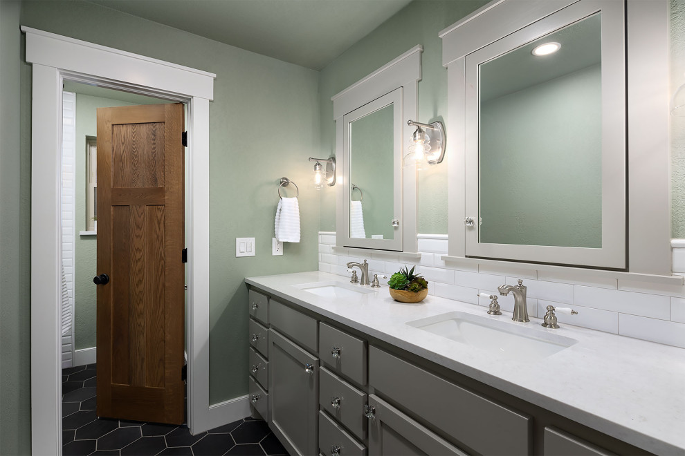 Photo of a mid-sized arts and crafts bathroom in Oklahoma City with shaker cabinets, grey cabinets, an alcove tub, a shower/bathtub combo, white tile, green walls, slate floors, an undermount sink, engineered quartz benchtops, black floor, a sliding shower screen, white benchtops, a double vanity and a built-in vanity.