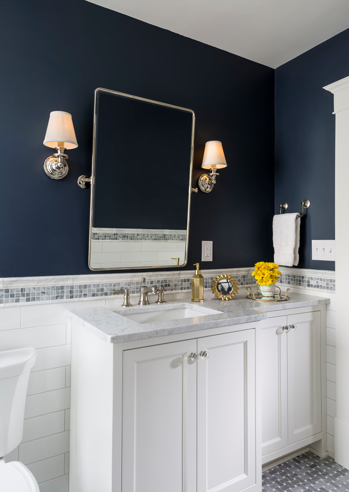 Example of a small classic white tile and ceramic tile marble floor, gray floor and single-sink bathroom design in Minneapolis with recessed-panel cabinets, white cabinets, a two-piece toilet, blue walls, an undermount sink, marble countertops, white countertops and a built-in vanity