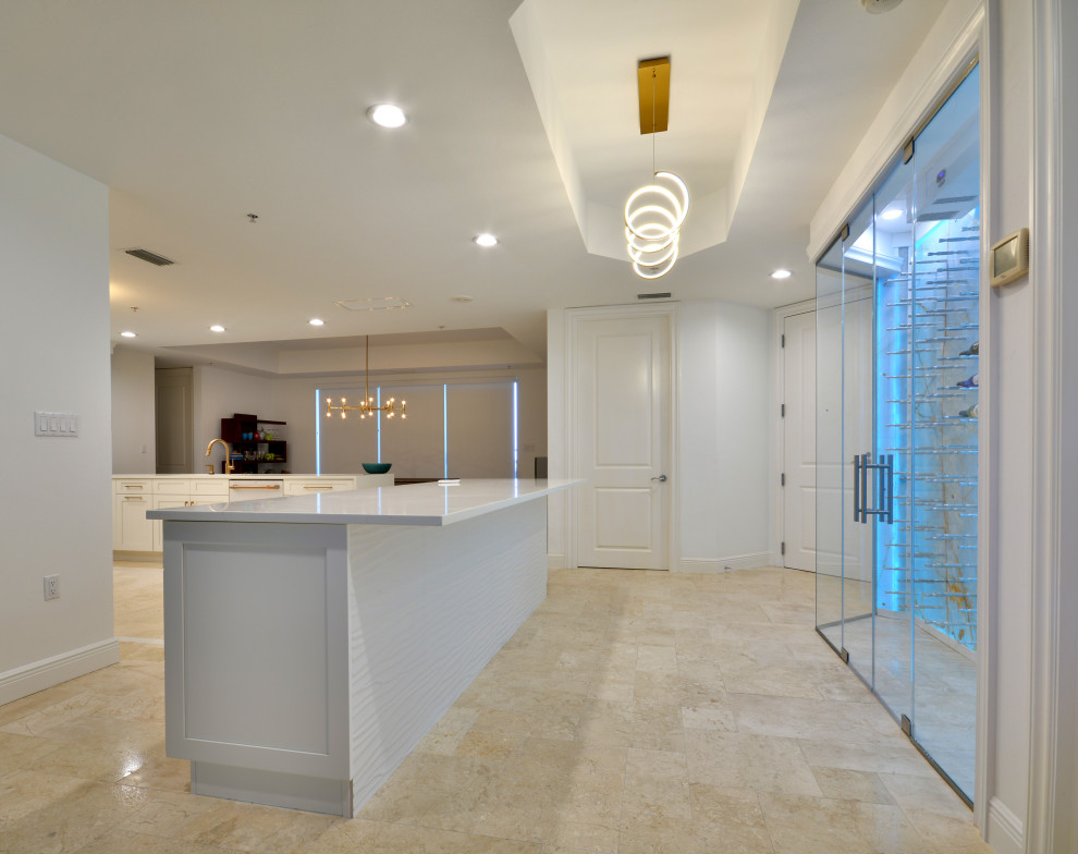 Large transitional u-shaped eat-in kitchen in Miami with an undermount sink, shaker cabinets, white cabinets, quartz benchtops, multi-coloured splashback, ceramic splashback, white appliances, travertine floors, with island, beige floor, white benchtop and coffered.