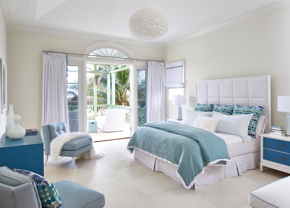 Design ideas for a large modern guest bedroom in Miami with travertine floors, no fireplace and beige floor.