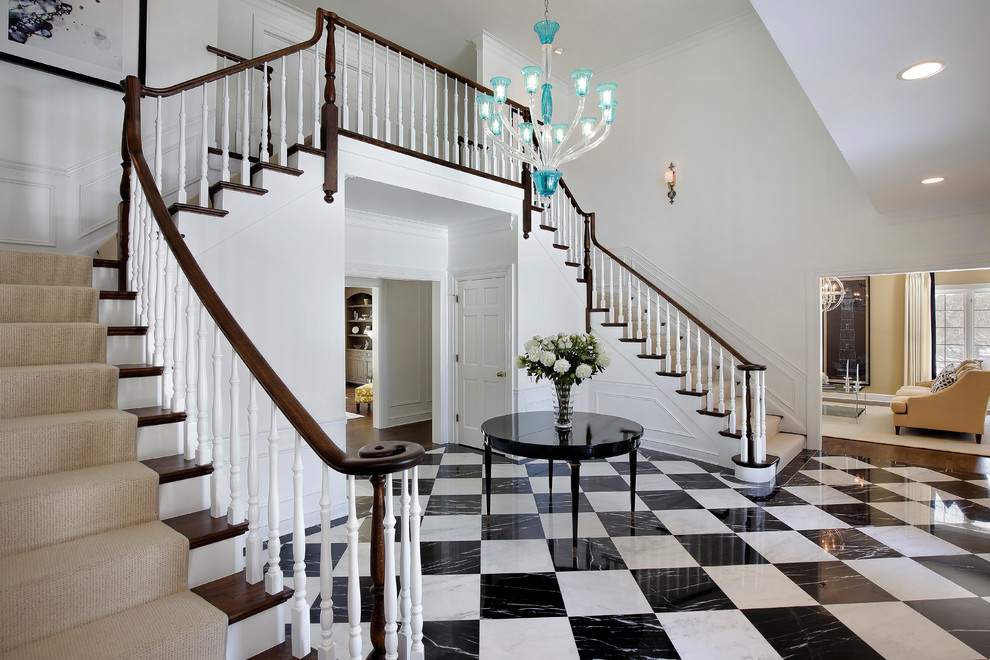 Inspiration for a large traditional wood l-shaped staircase in Chicago with painted wood risers and wood railing.