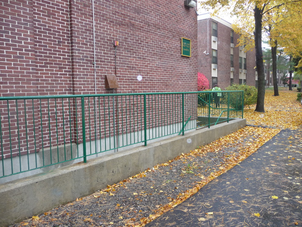 Staircase - modern straight metal railing staircase idea in Boston