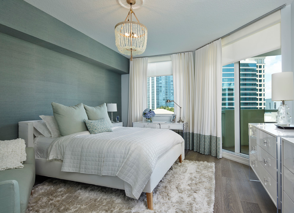 Design ideas for a transitional bedroom in Miami with green walls and medium hardwood floors.