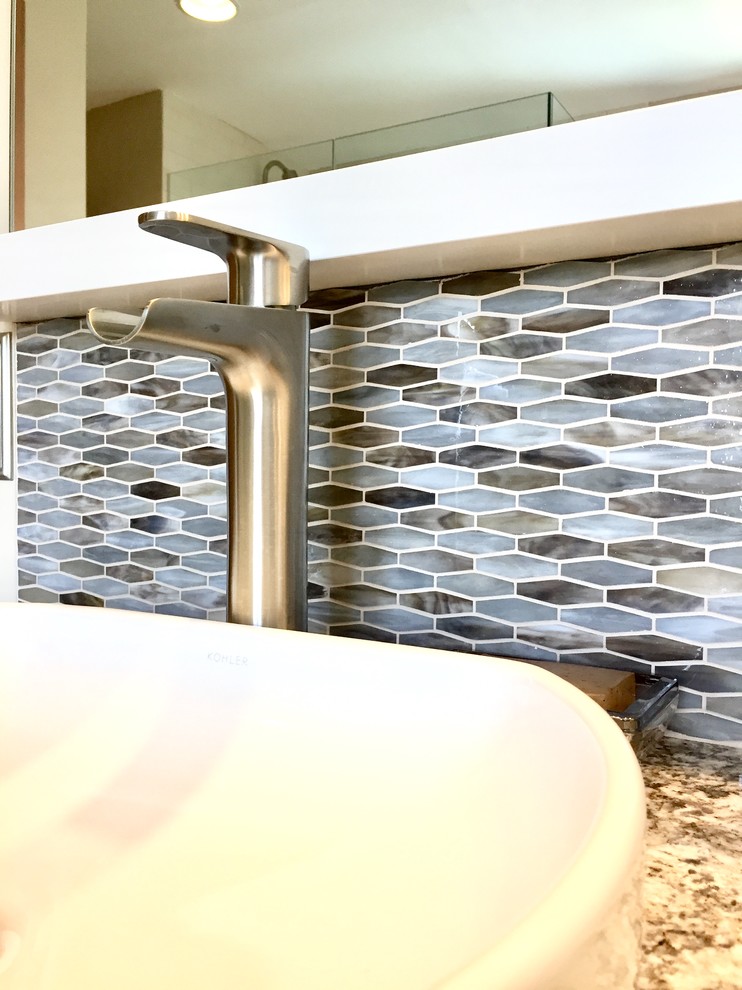 Inspiration for a transitional master multicolored tile and mosaic tile porcelain tile and brown floor freestanding bathtub remodel with shaker cabinets, white cabinets, a vessel sink, quartz countertops, a hinged shower door and multicolored countertops