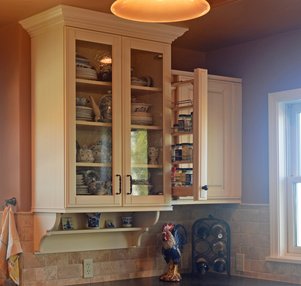 Photo of a large traditional u-shaped kitchen in San Luis Obispo with raised-panel cabinets, white cabinets, beige splashback, brick splashback and with island.