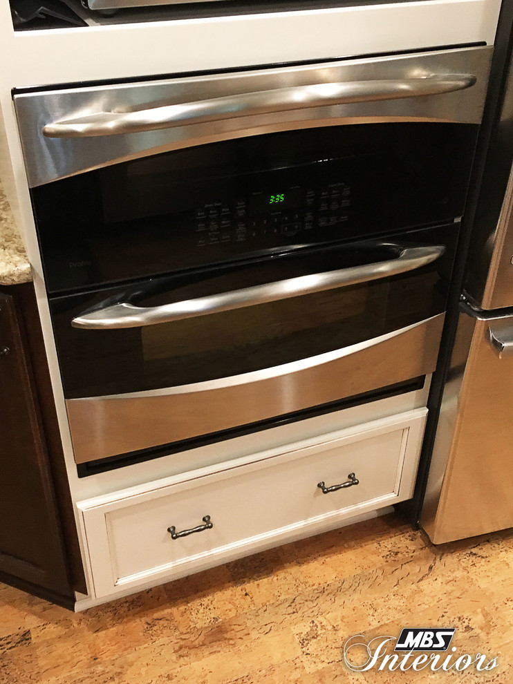 Example of a small transitional u-shaped eat-in kitchen design with an undermount sink, recessed-panel cabinets, white cabinets, quartzite countertops, multicolored backsplash, mosaic tile backsplash, stainless steel appliances and no island
