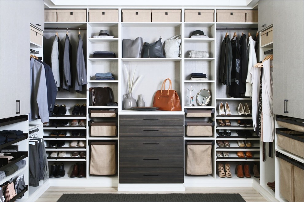 Design ideas for a contemporary gender-neutral walk-in wardrobe in Dallas with open cabinets, brown cabinets, light hardwood floors and beige floor.