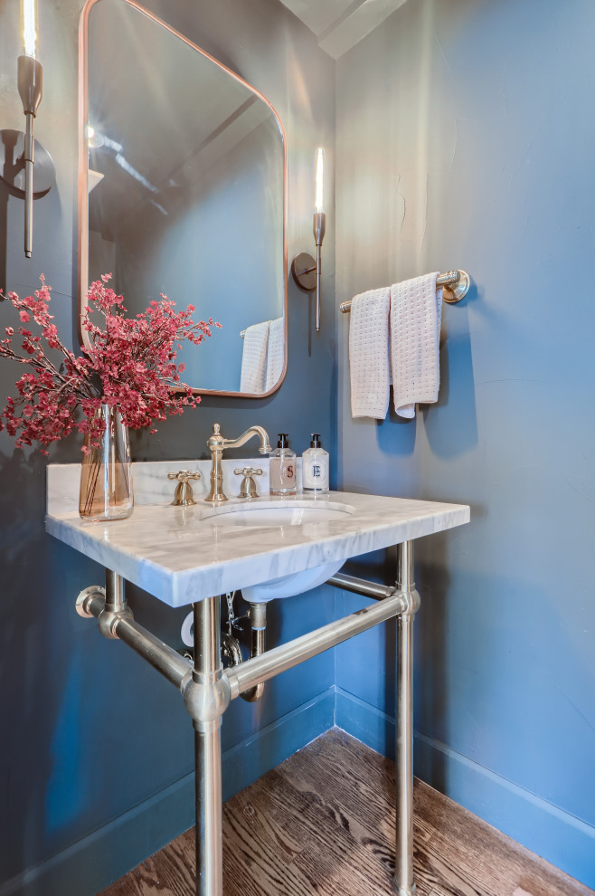 Inspiration for a mid-sized modern medium tone wood floor and beige floor powder room remodel in Denver with blue walls, an undermount sink, quartz countertops, white countertops and a freestanding vanity