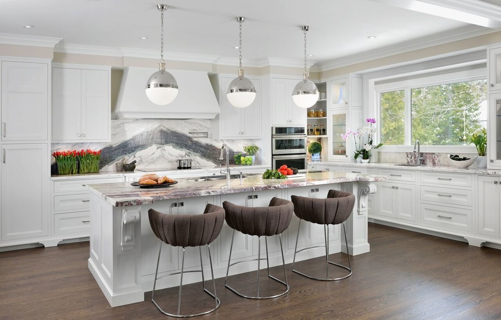 Design ideas for a mid-sized transitional l-shaped open plan kitchen in Toronto with recessed-panel cabinets, white cabinets, grey splashback, dark hardwood floors, with island, an undermount sink, stone slab splashback and stainless steel appliances.
