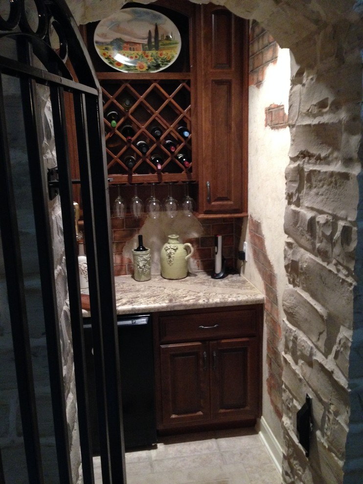 Design ideas for a small country wine cellar in Houston with ceramic floors and diamond bins.