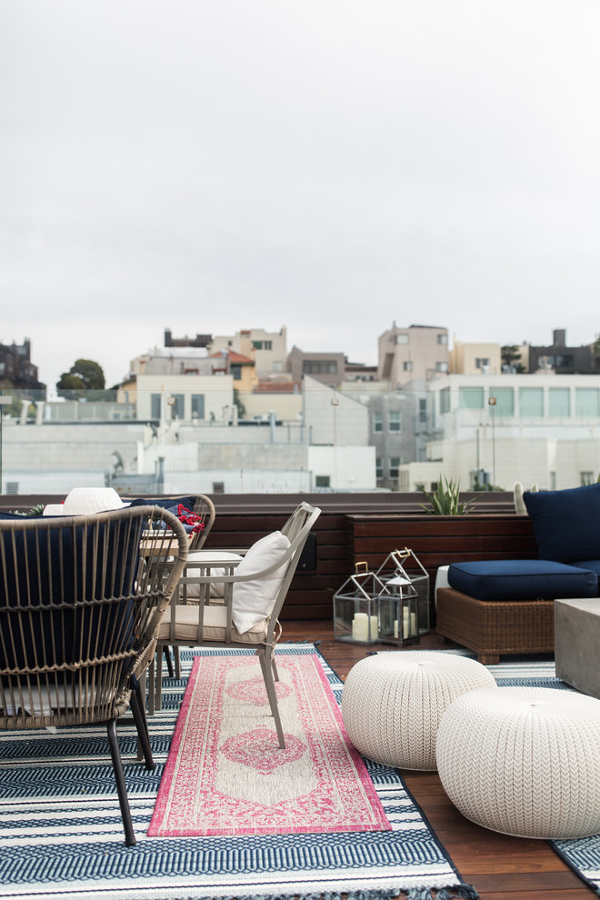 Inspiration for a mid-sized eclectic backyard patio remodel in San Francisco with decking and no cover