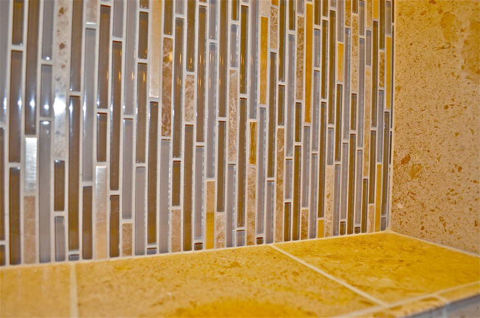 Example of a mountain style travertine floor home design design in Omaha with an undermount sink and solid surface countertops