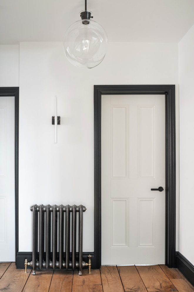 Inspiration for a contemporary hallway in London with white walls.